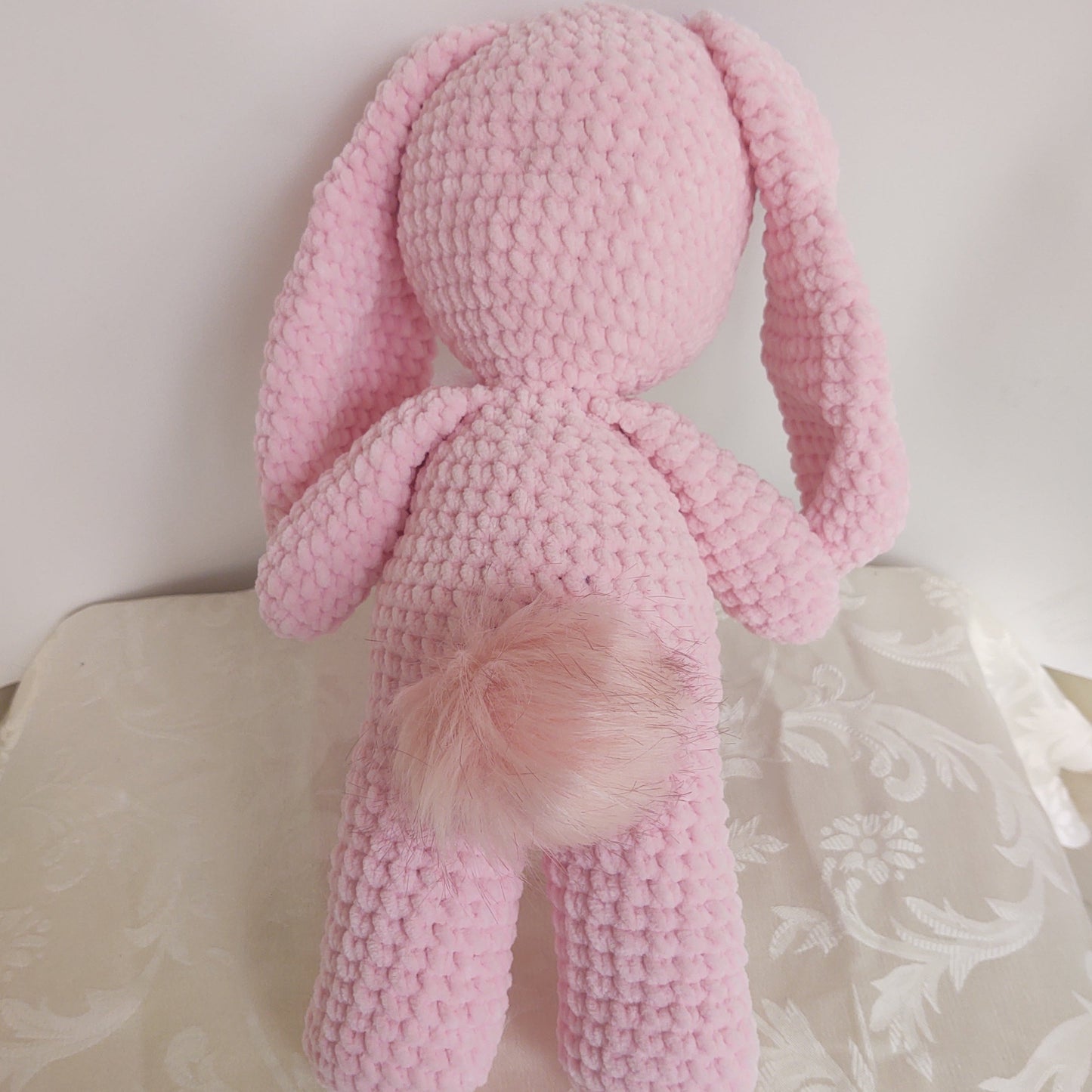 Back of Plush bunny showing faux fur tail
