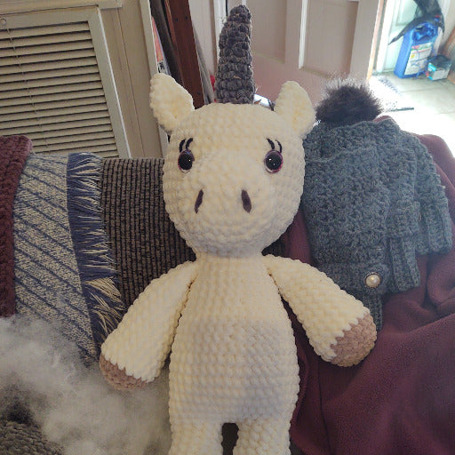 not completed Unicorn with dark gray horn and beige hooves