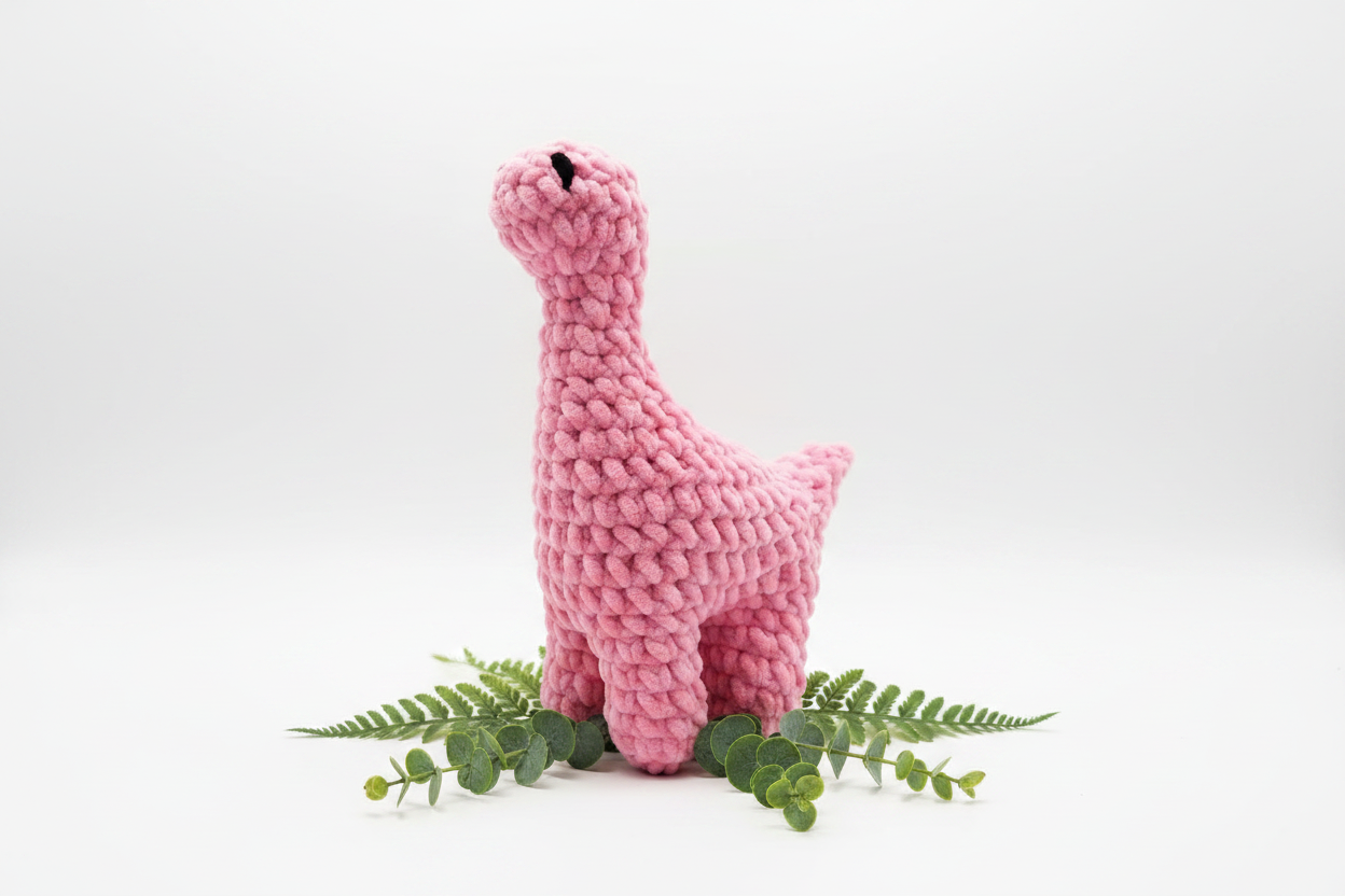 Pink Bubblegum Brontosaurus on white background with greenery