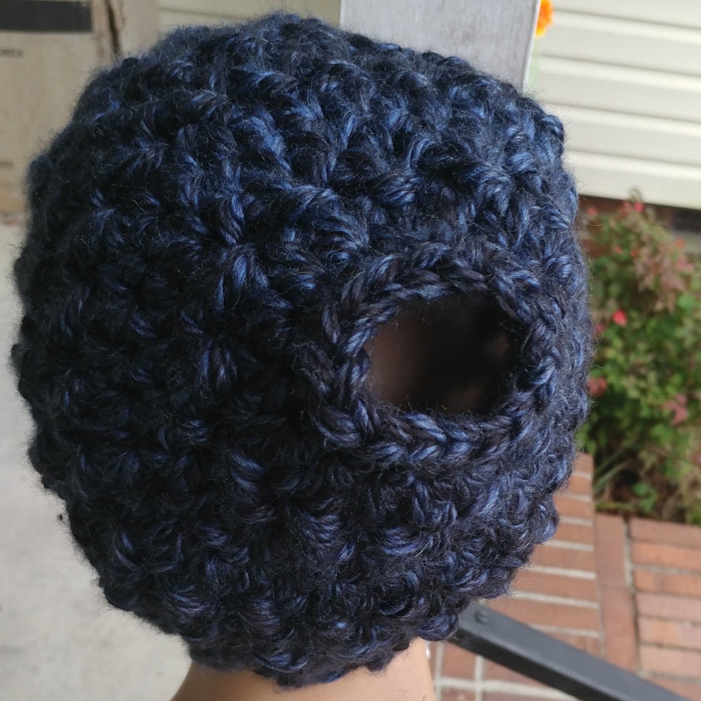 Milwakee Midnight color top bun hat on a manequin head