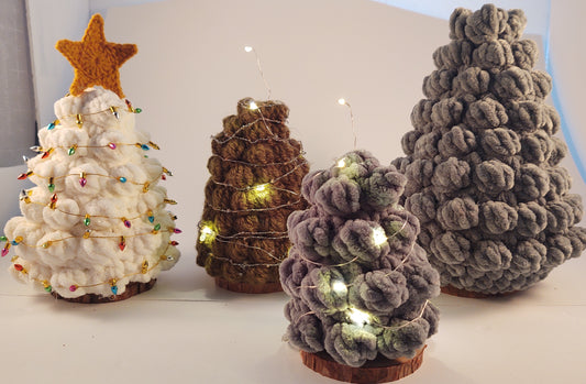 Two small Christmas trees with fairy lights, one large Christmas Tree with no lights. White Christmas Tree with non working lights and crochet star